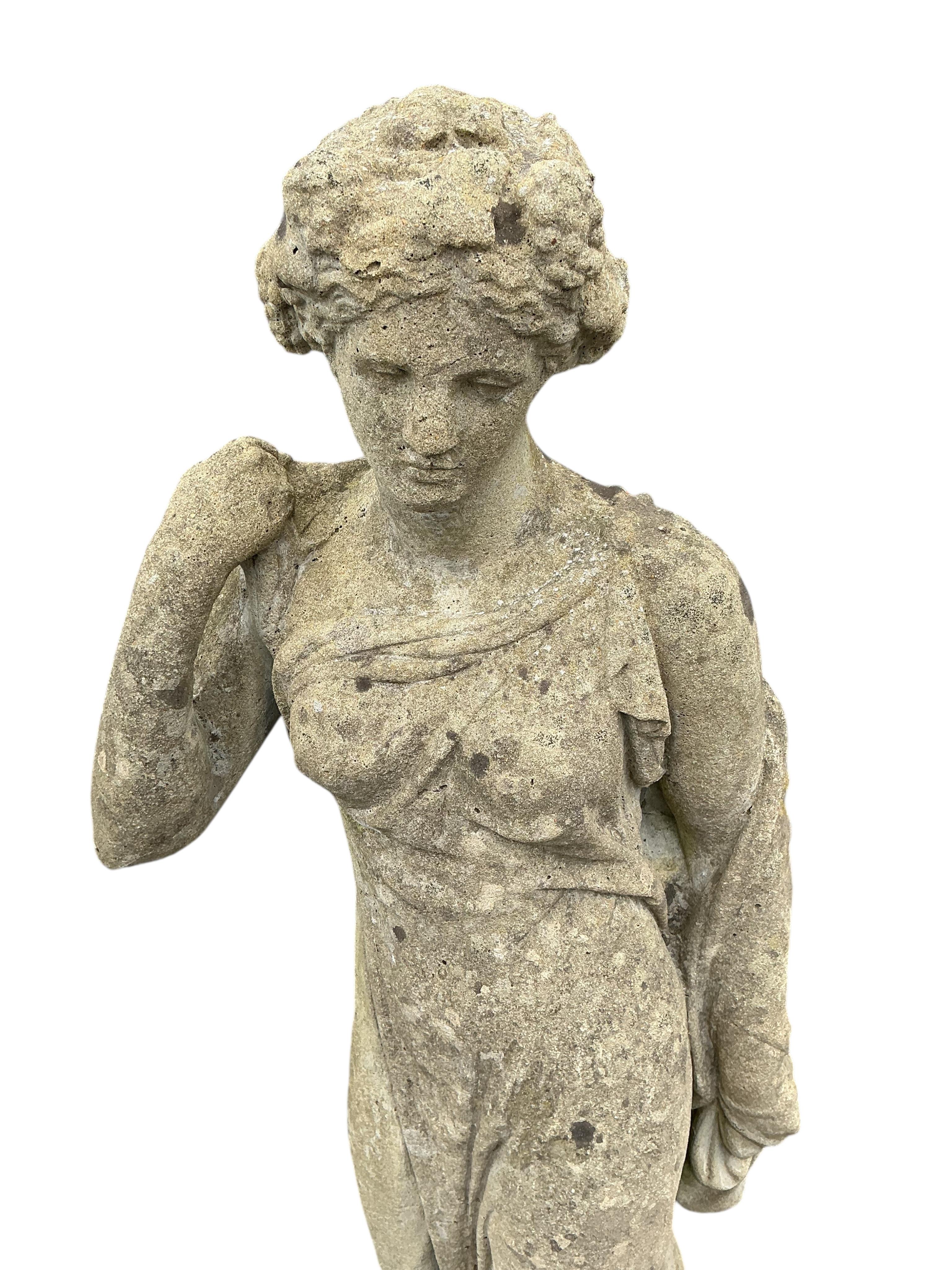 A large reconstituted stone garden statue of a standing classical female on square plinth, height 194cm
